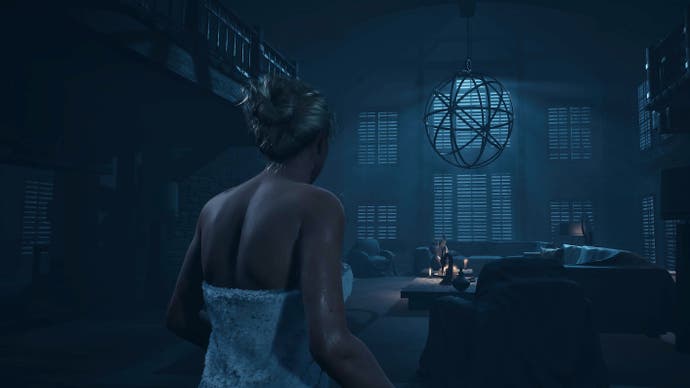 Until Dawn PS5 screenshot showing a blond female walking through a dark house in a towel